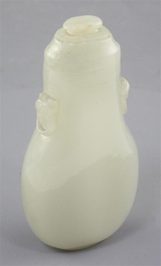 A Chinese pale celadon jade flattened baluster snuff bottle and cover, 19th century, 8.5cm